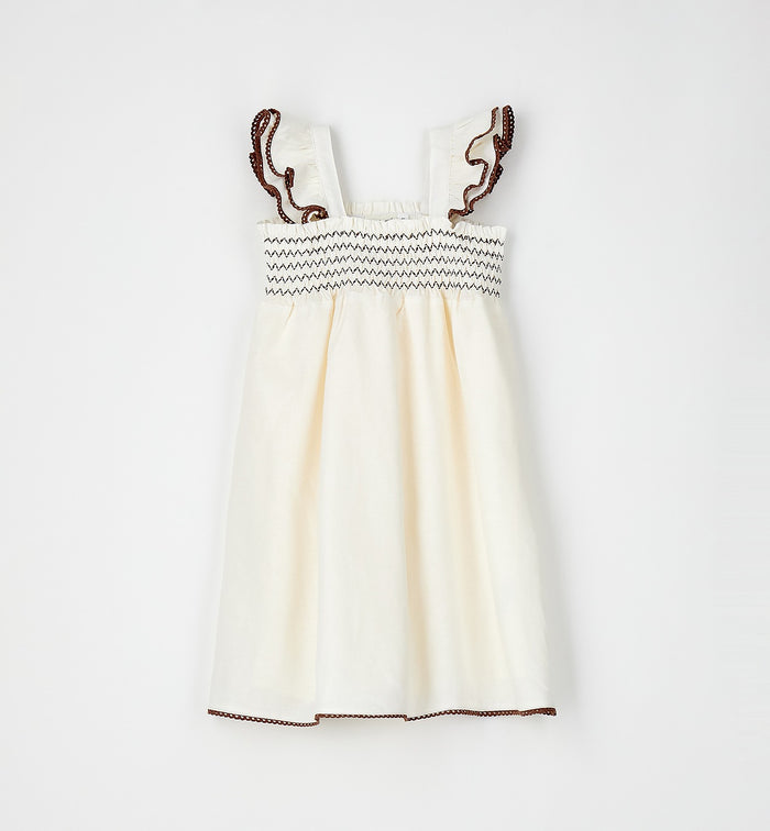 abito bimba panna elegante con rifiniture marroni