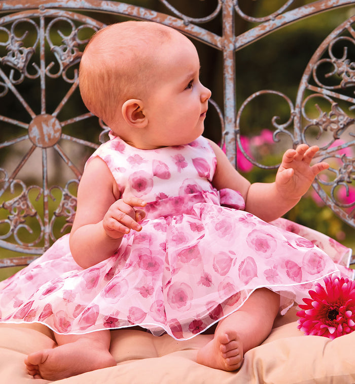 Abito bimba primo compleanno rosa con fantasia floreale e gonna ampia