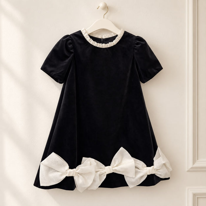 Abito elegante bambina nero con tre maxi fiocchi avorio e maniche a palloncino