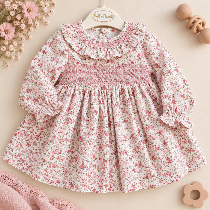 Abito bimba in cotone floreale rosa con lavorazione smock e colletto volant