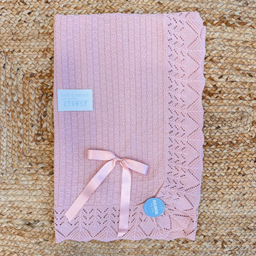 Copertina neonata rosa con fiocco e bordo a rombi