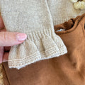 dettaglio polsino a volant maglia beige