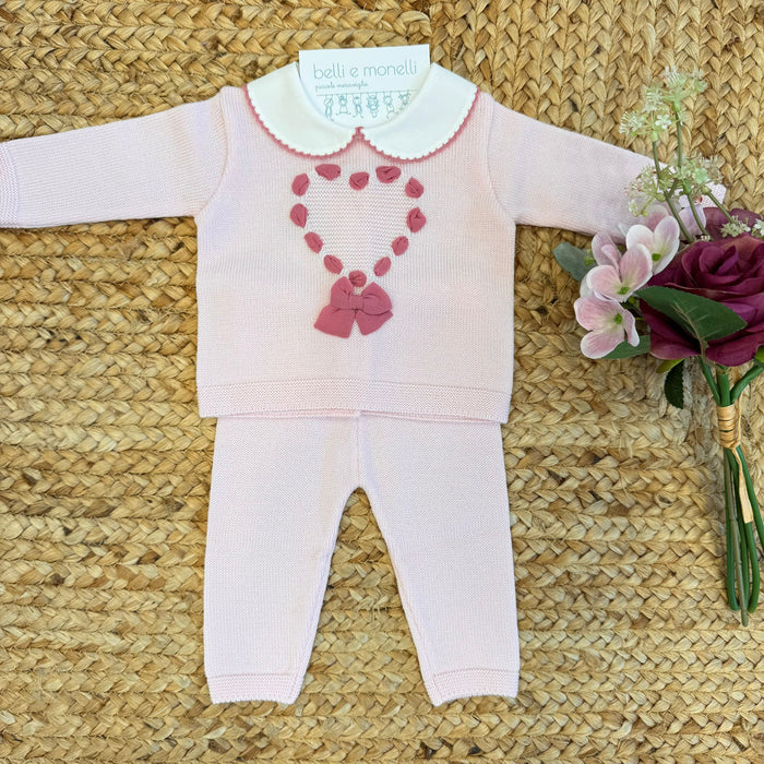 Tutina neonata in pura lana rosa antico con cuore in passanastro e fiocco.