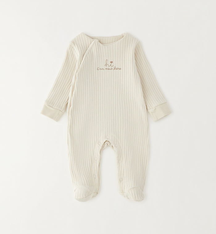 Tutina neonato in cotone panna a costine