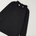 Lupetto bimba nero con collo arricciato e maniche lunghe. Elegante sotto vestiti, salopette e abitini natalizi. Scoprilo su Belli e Monelli.