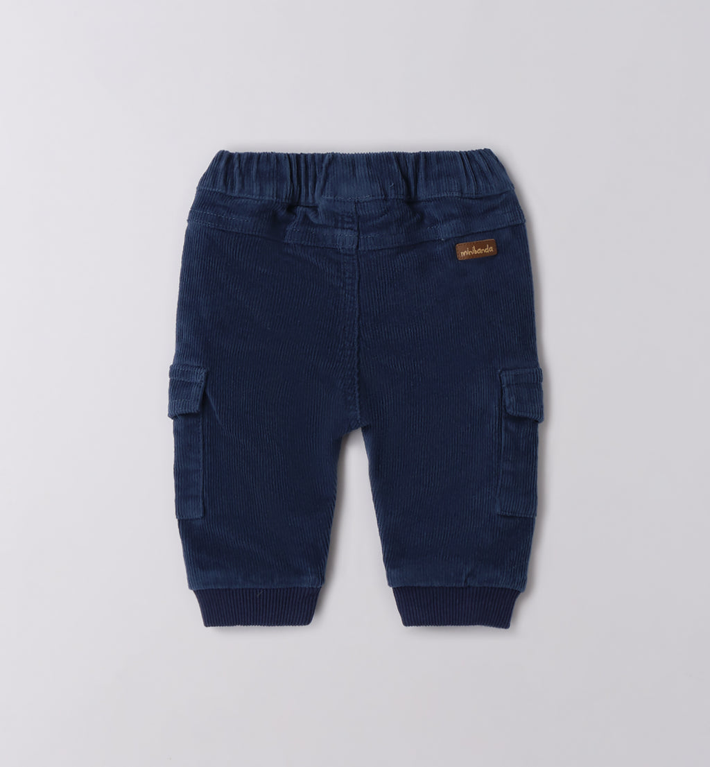 Bimbo maglia dinosauri e pantaloni blu