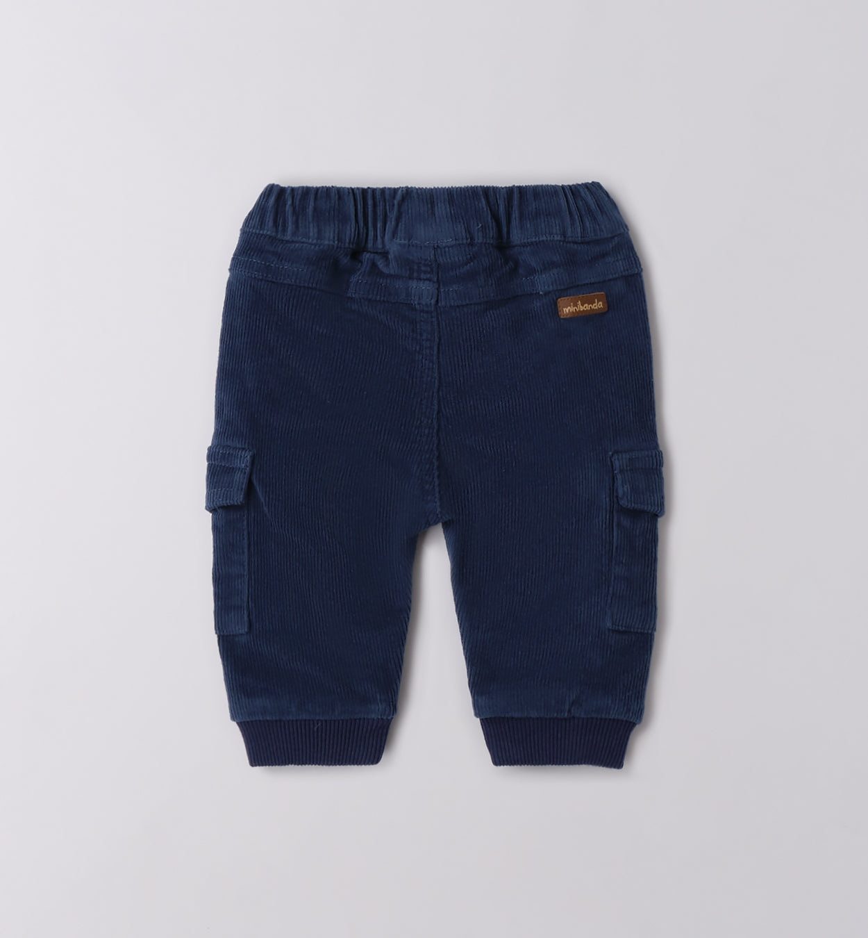 Bimbo maglia dinosauri e pantaloni blu