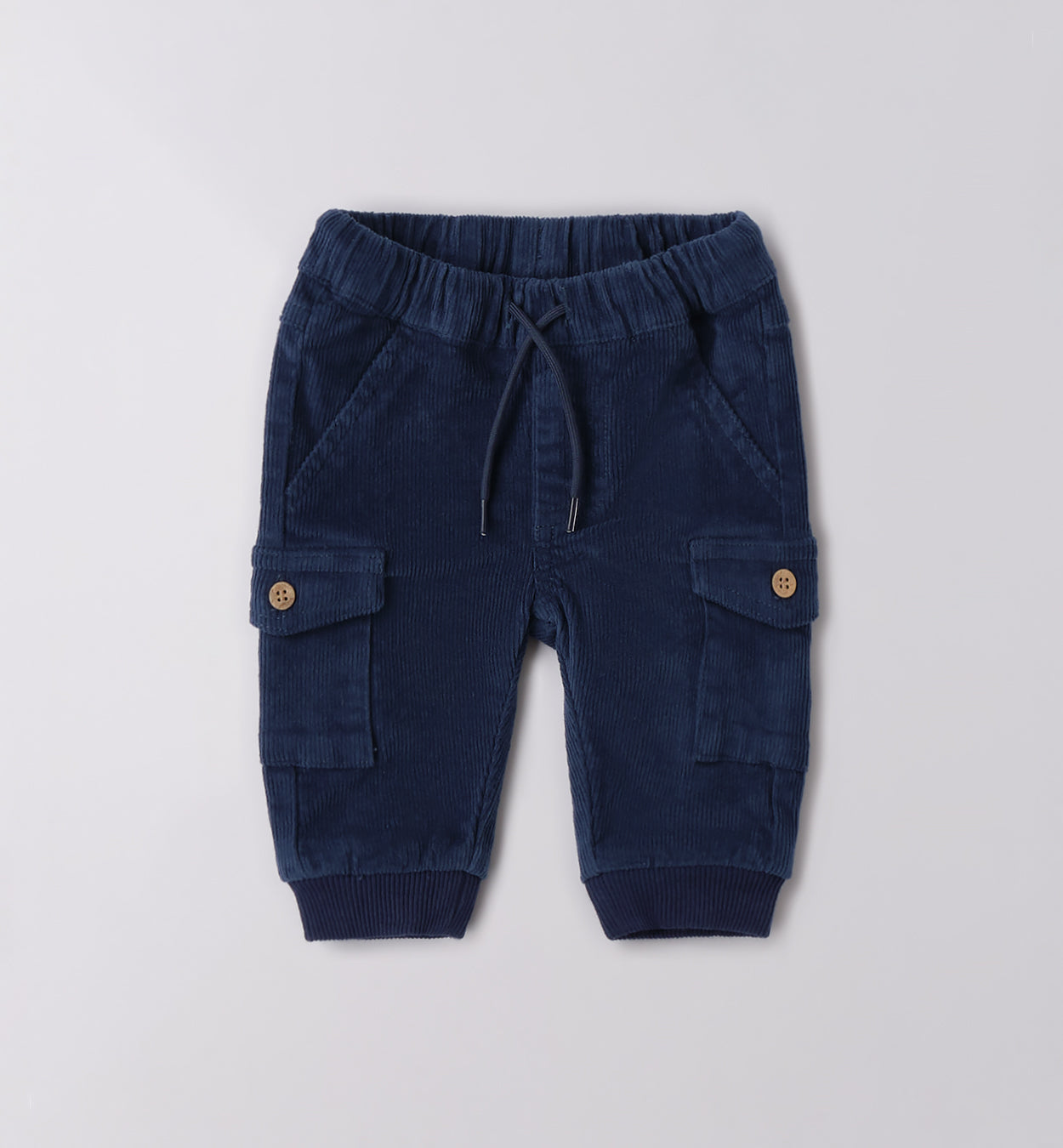 Bimbo maglia dinosauri e pantaloni blu