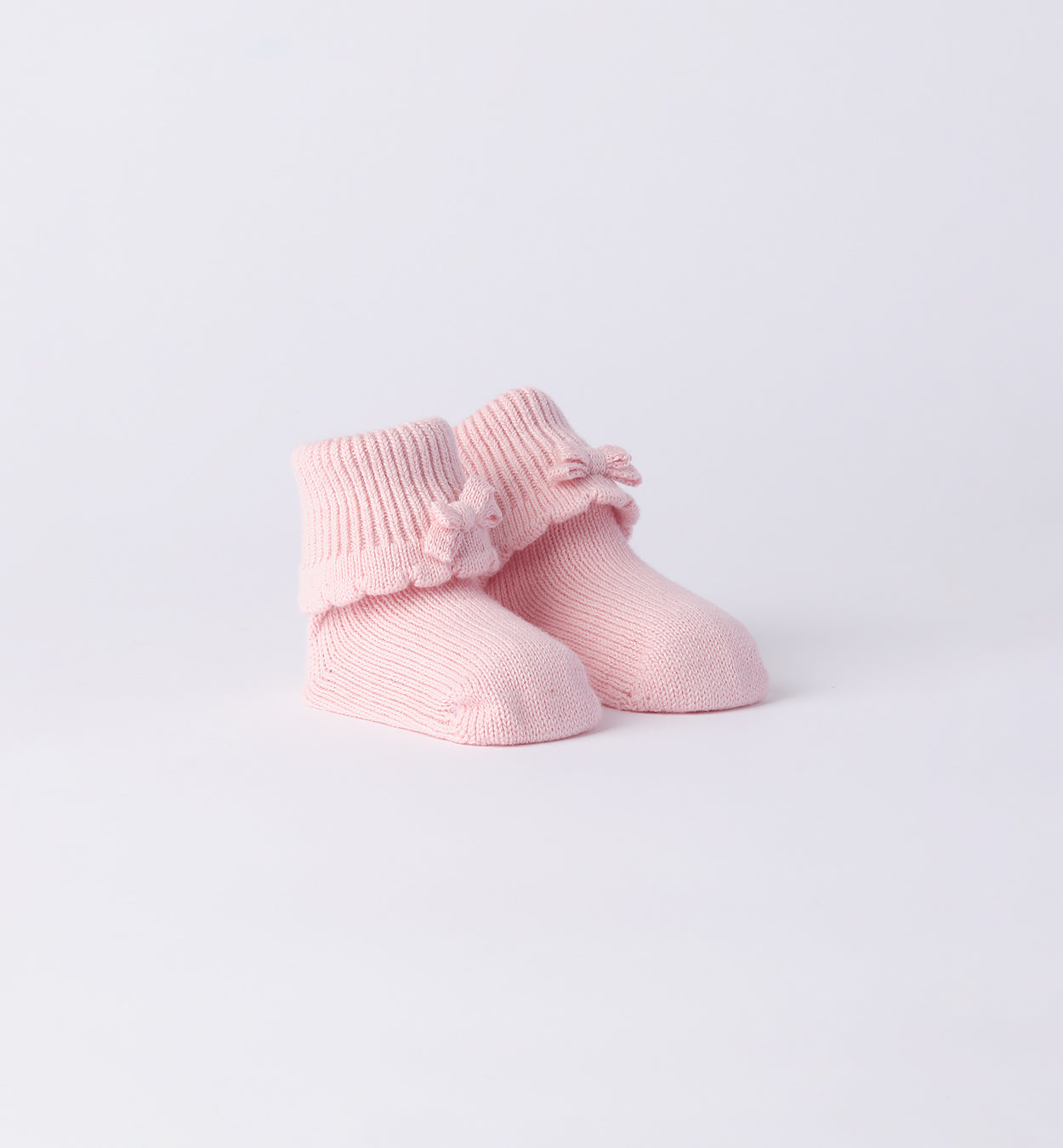 Scarpette neonata in lana-cotone rosa e panna con fiocco