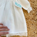 Abito battesimo bimba bianco avorio con smock, pizzo e cuffietta