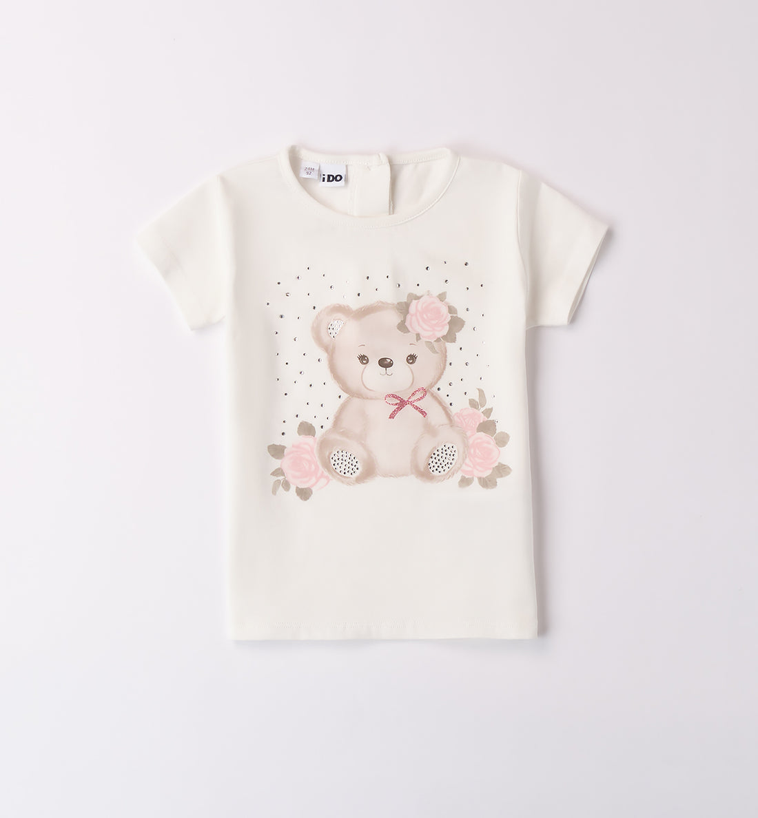 Completo bambina con maglietta orsetto e pantalone rosa elegante, su sfondo in juta.