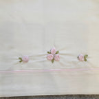 Uscita clinica ciniglia rosa e grigia con fiocchi e roselline ricamate