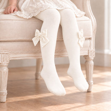 Collant bambina panna con fiocchi decorativi laterali