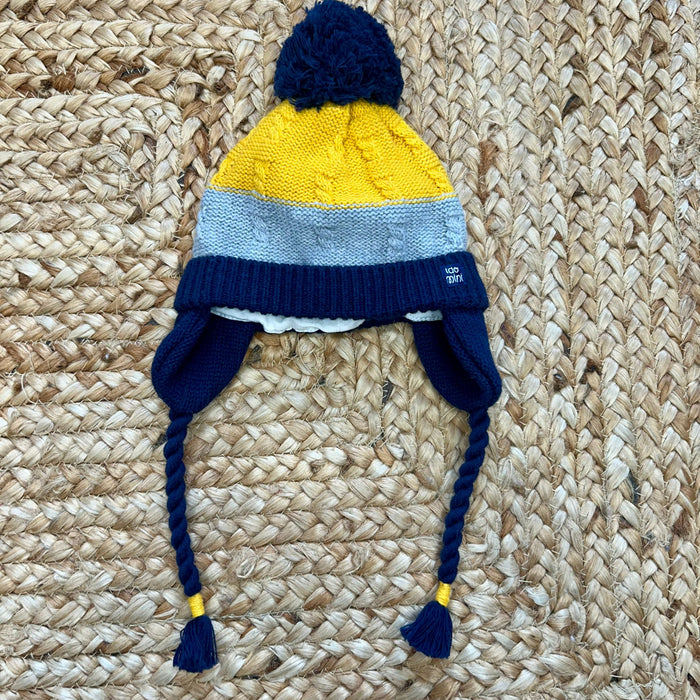 Cappellino bimbo tricolore con pon pon