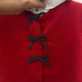 Completo bimba con cardigan rosso in misto lana, fiocchi blu e gonna tartan grigia con orsetti.
