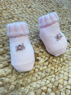 Uscita clinica neonata lana rosa con ricami floreali