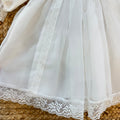 Abito battesimo bimba bianco avorio con smock, pizzo e cuffietta