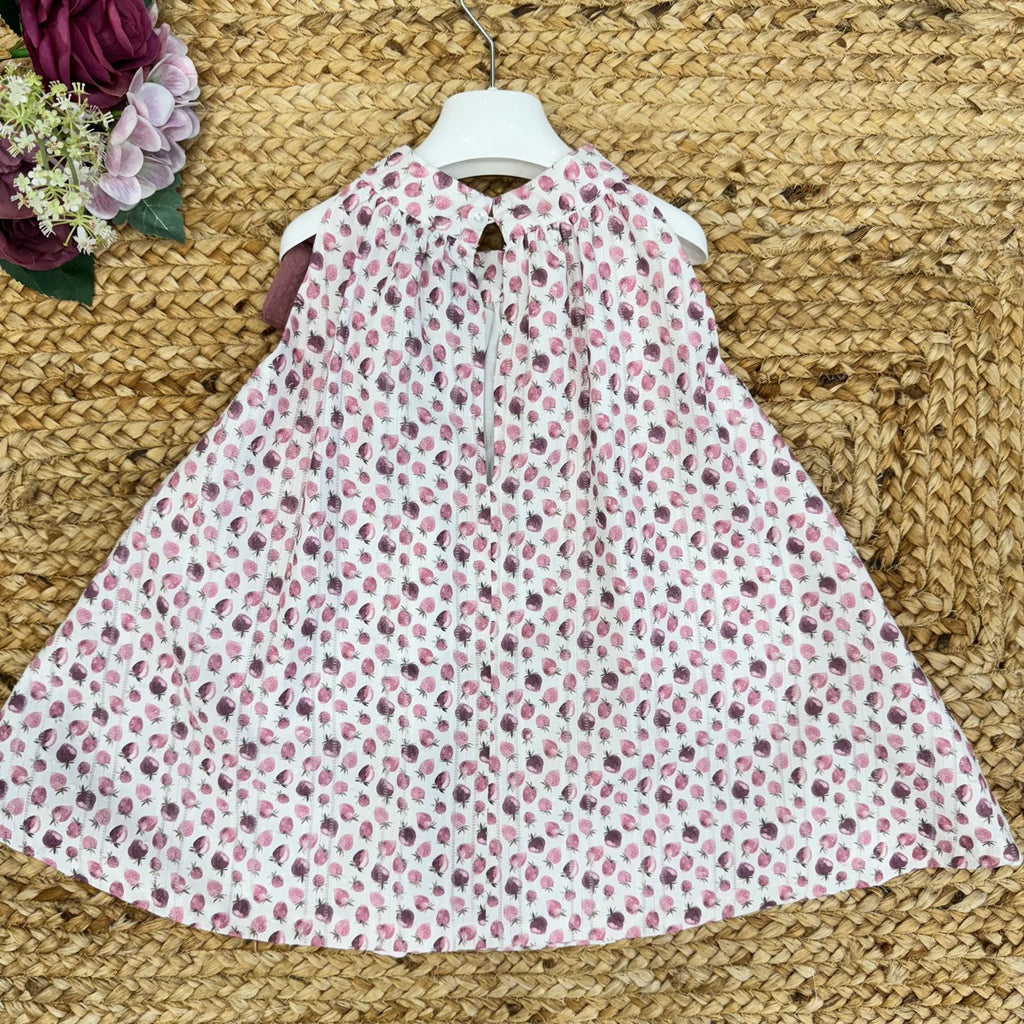 Retro dell'abito per bambina con apertura e chiusura a bottone, pratico e comodo per la stagione estiva.