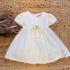 abito-bianco-bambina-fiocco-nappina