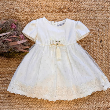 abito-bianco-bambina-fiocco-nappina