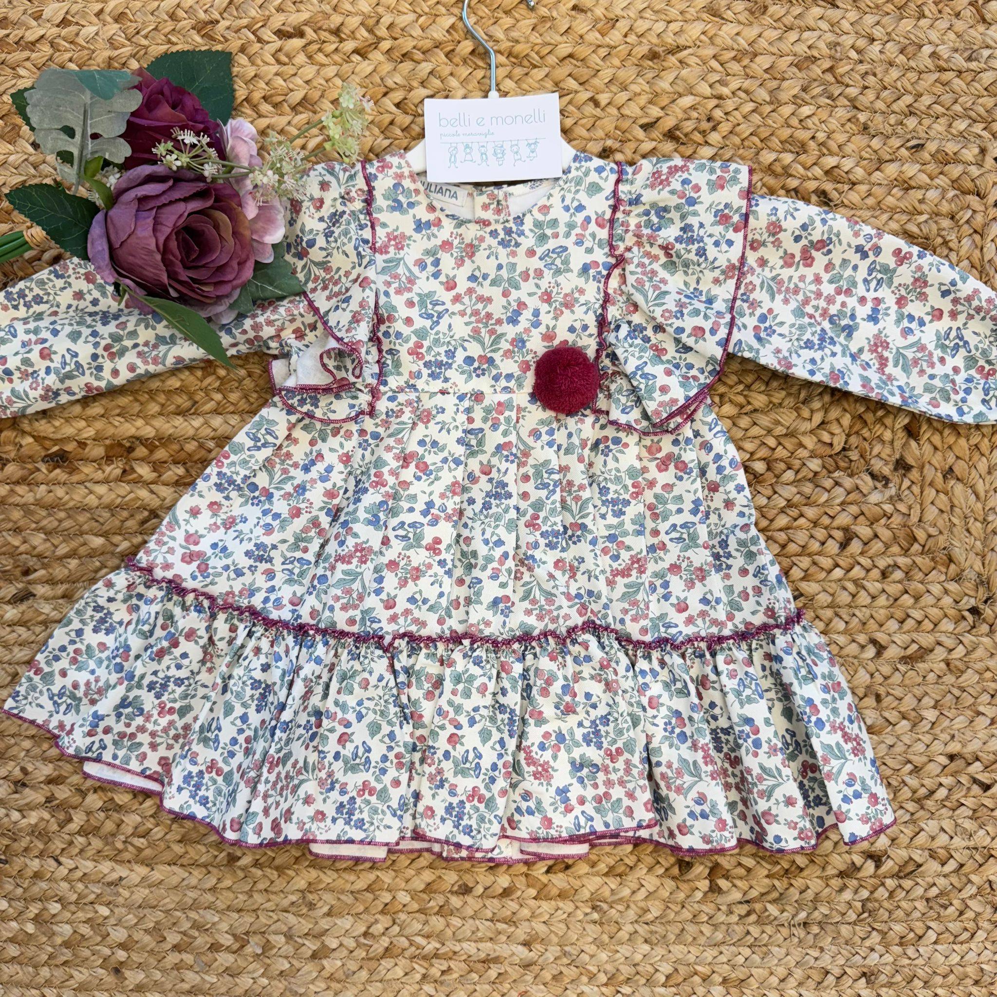 Abito floreale bambina con volant e pompon bordeaux