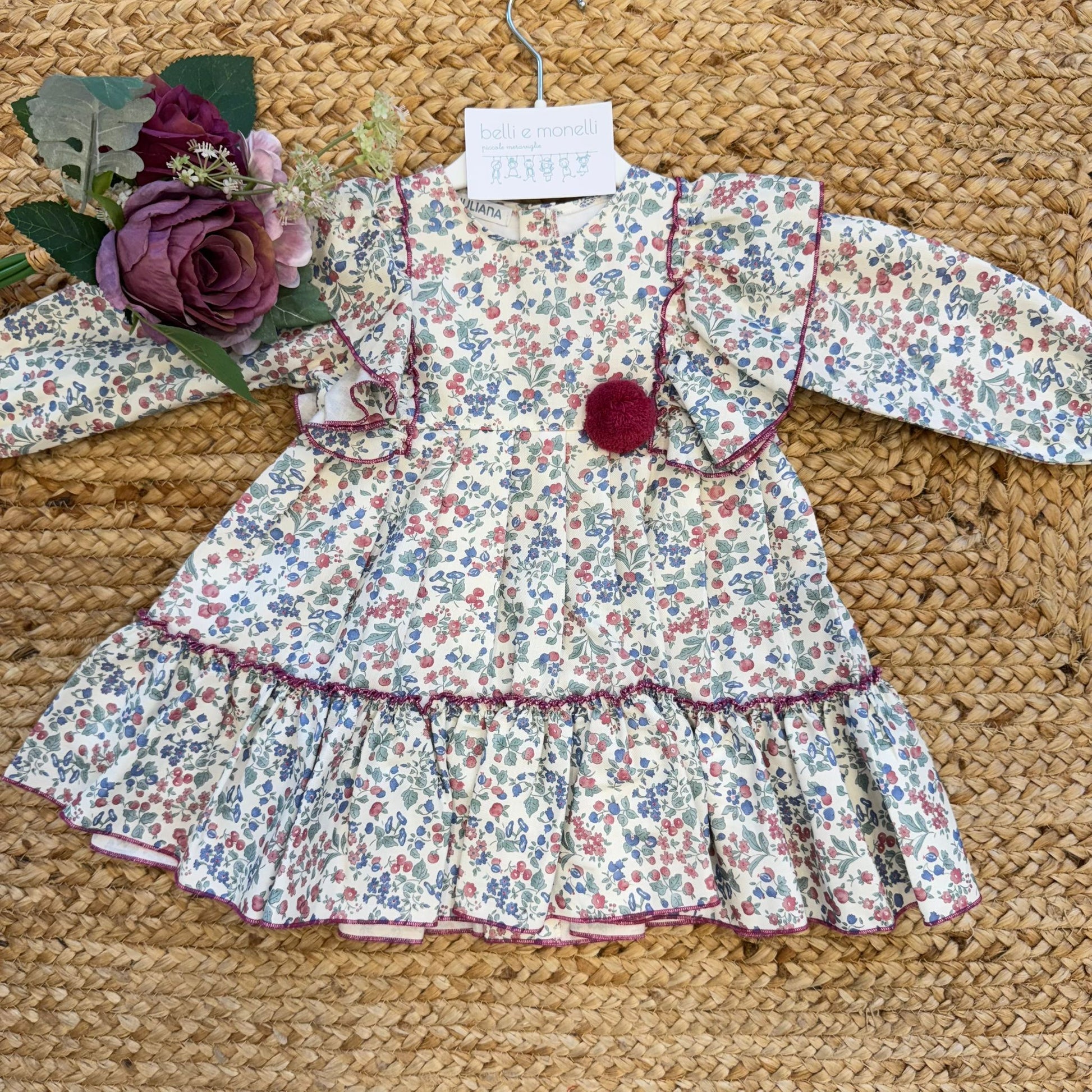 Abito floreale bambina con volant e pompon bordeaux