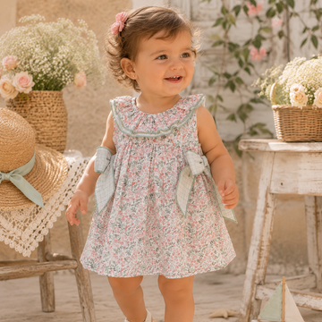 Vestito in cotone floreale con fiocchi laterali