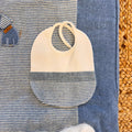 Bavetta in cotone panna con bordo rigato blu
