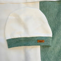 Cappellino neonato caldo cotone con risvolto pied de poule

