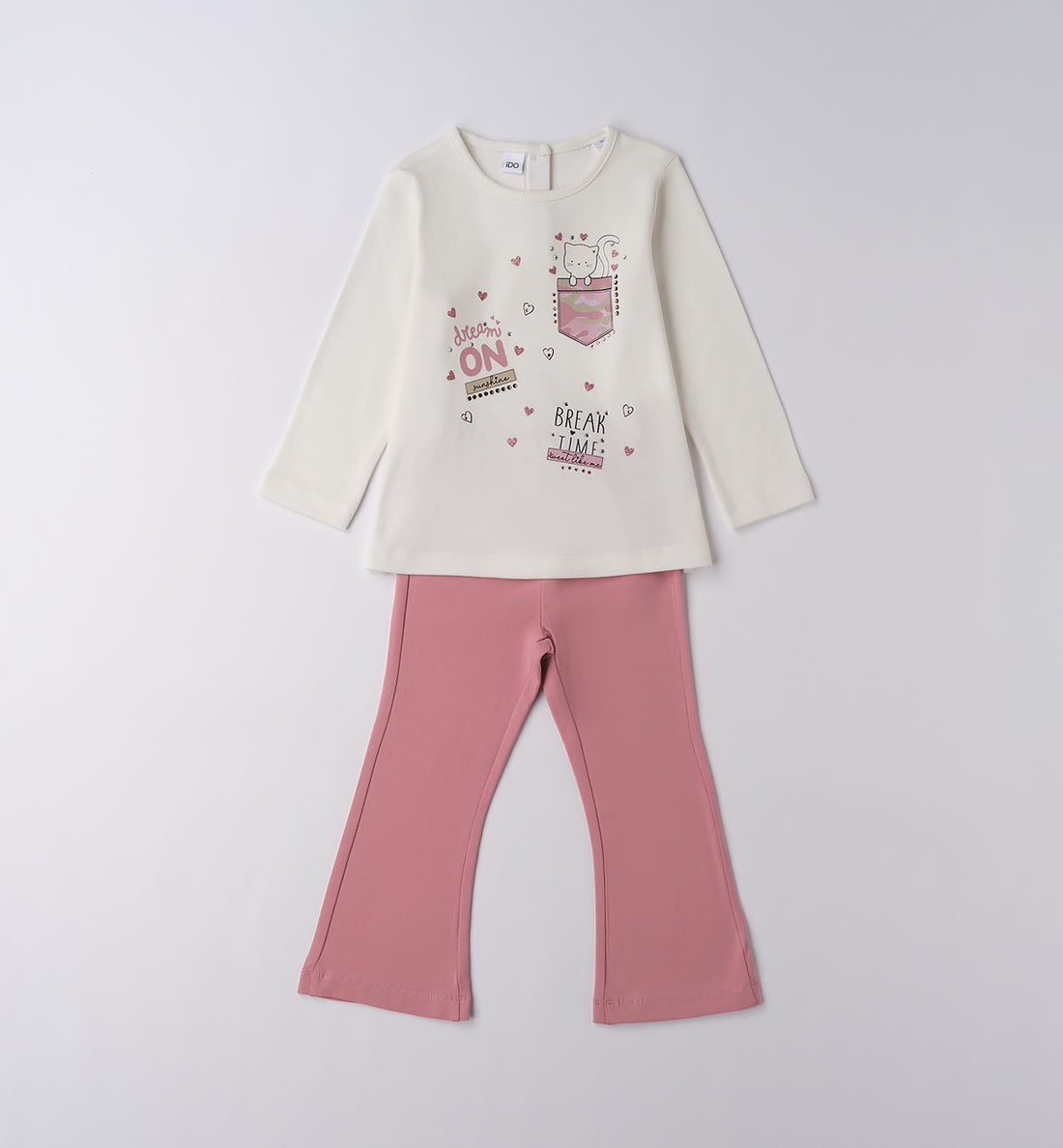 Completo bambina in cotone con maglia bianca e pantaloni rosa.