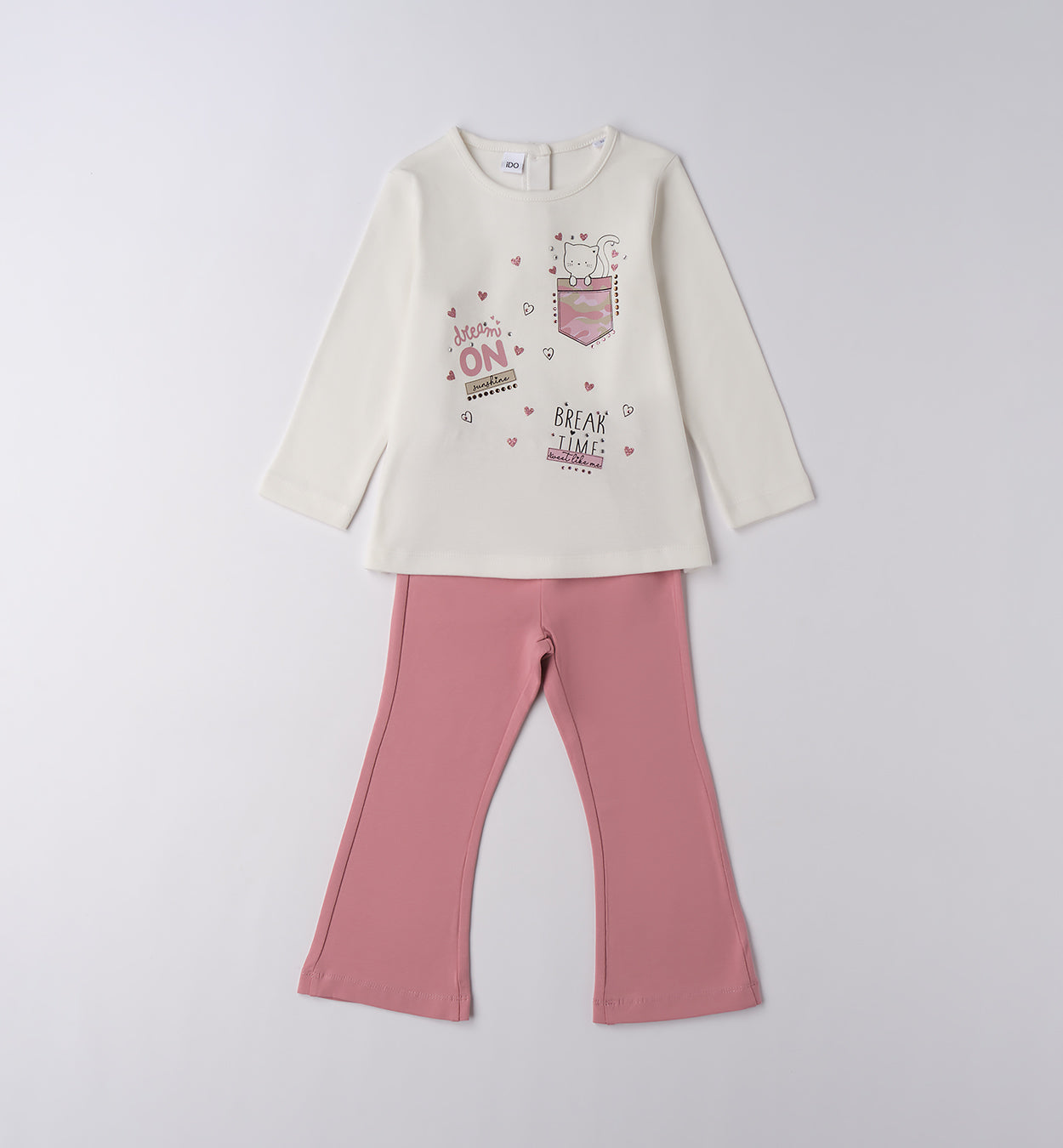 Completo bambina in cotone con maglia bianca e pantaloni rosa.