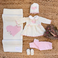 Coordinato uscita clinica neonata rosa cipria in pura lana con fiocchi ricamati