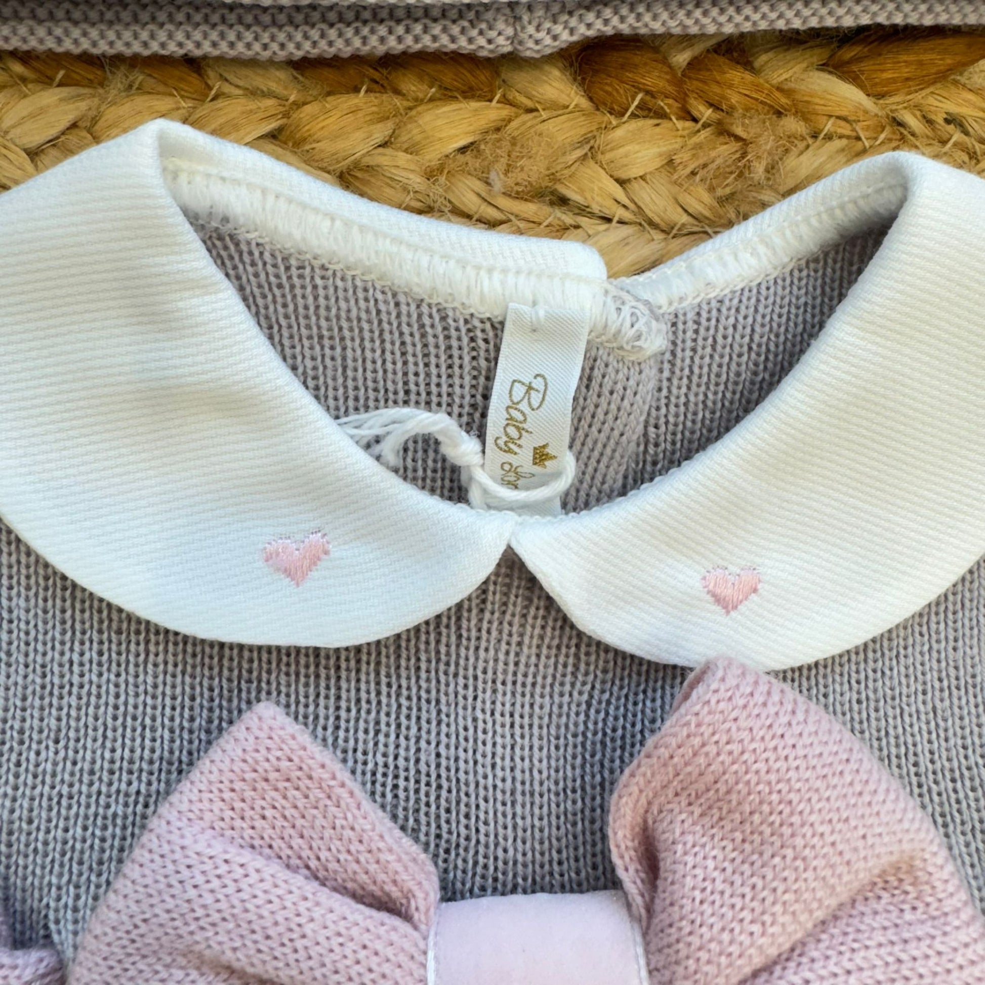Copertina neonata in pura lana grigio con maxi fiocco rosa