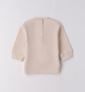 Dettaglio cuori e fiocchetti su felpa bimba beige