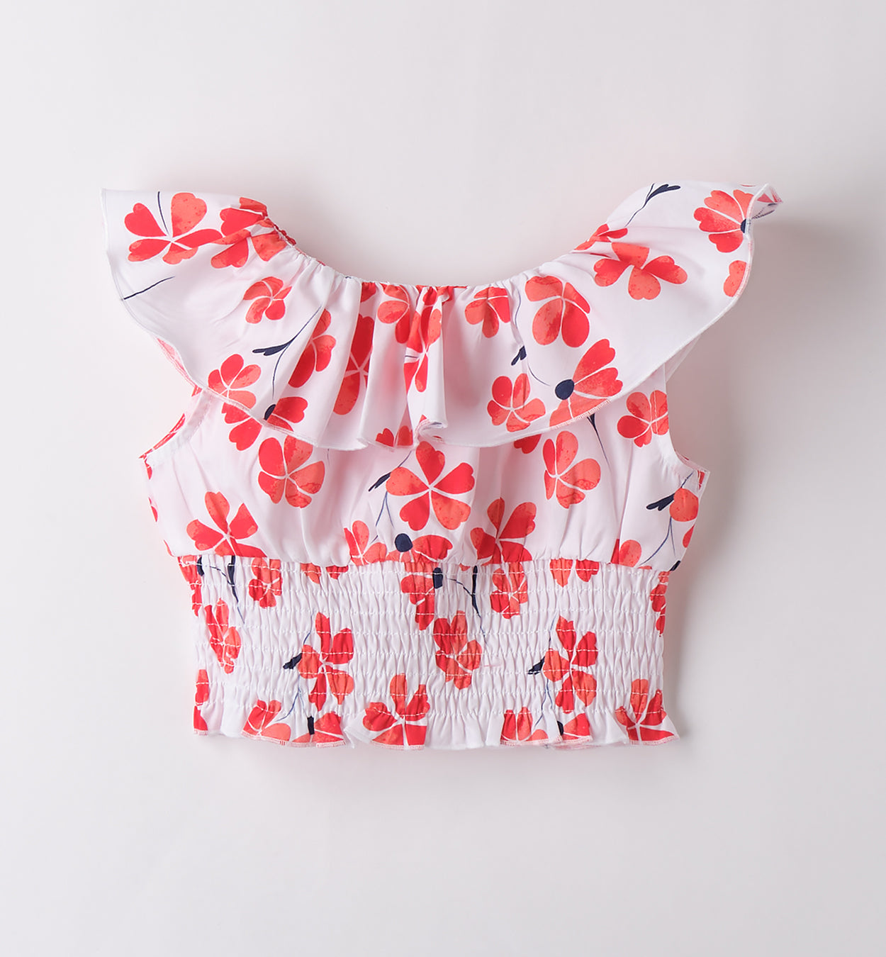 Retro top estivo per bambina con fascia elastica in vita e stampa floreale.

