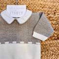 Retro della tutina neonato misto lana con bottoncini