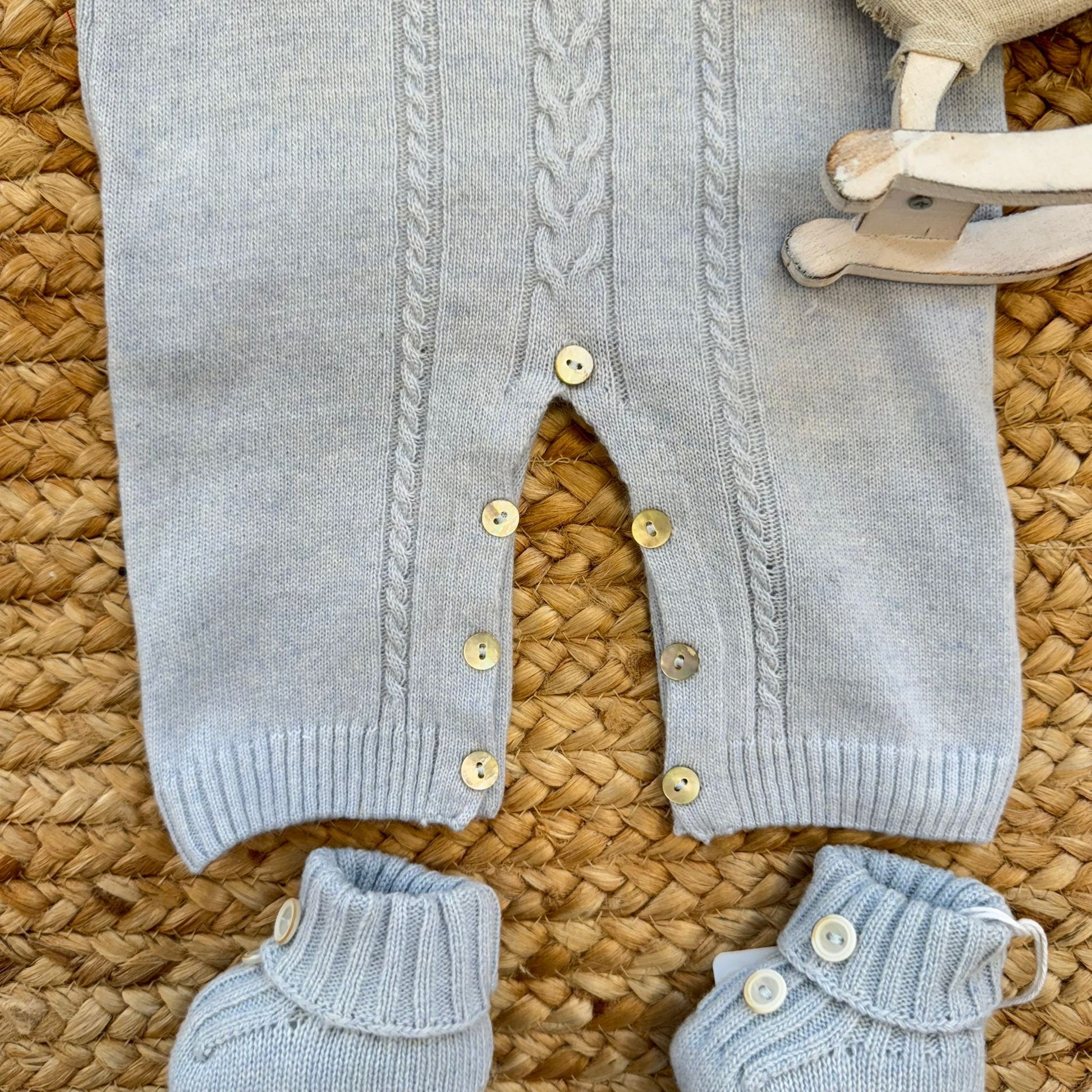 Tutina neonato pura lana azzurra dettaglio bottoncini