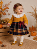 Abitino bimba senape con gonna scozzese tartan e colletto bianco ricamato.