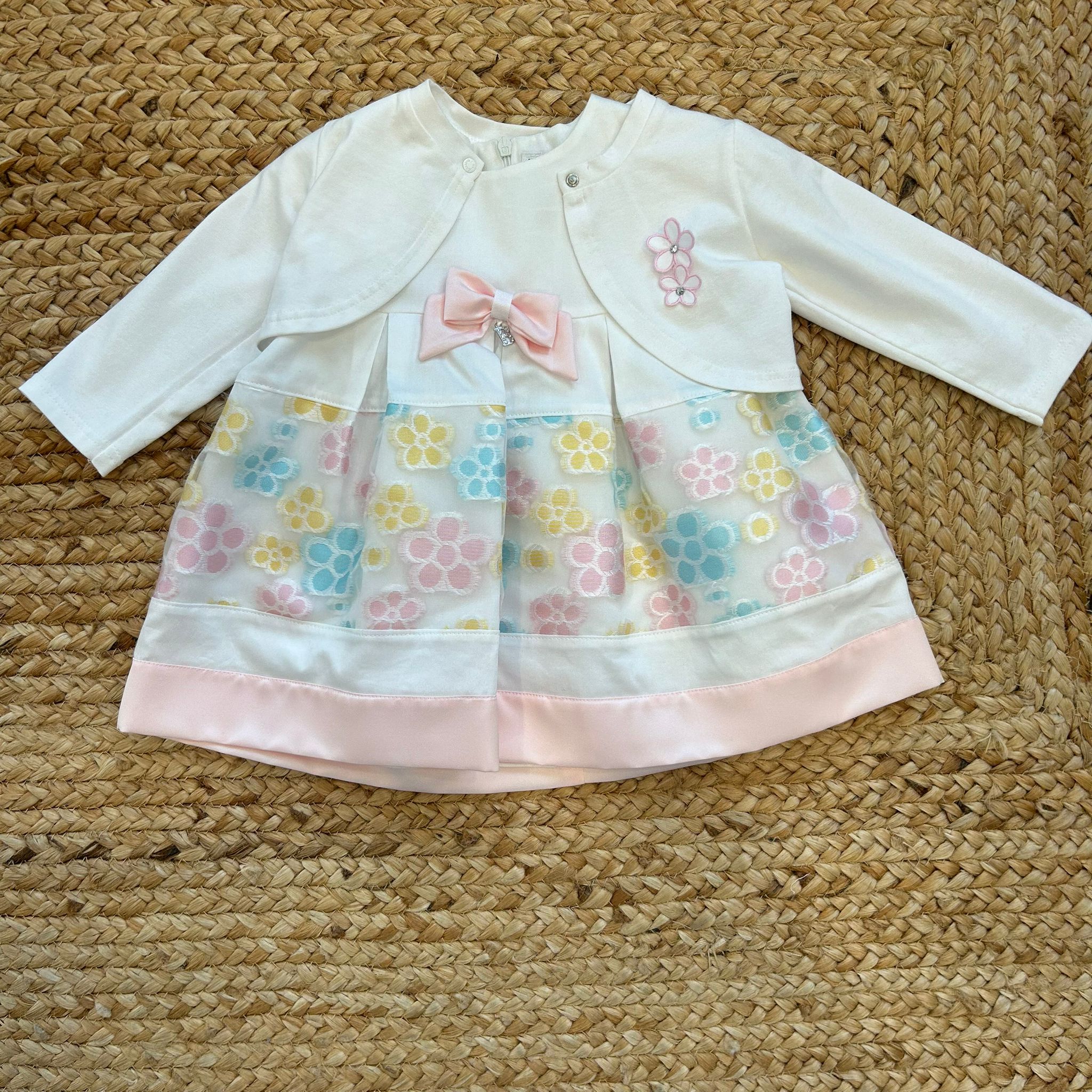 Abito bambina con giacchina bianca, fiocco rosa e fiori ricamati pastello