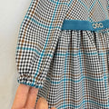 Abito bimba primo compleanno pied de poule con fascia petrolio e applicazione gioiello