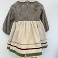 Abito elegante bimba panna con corpetto pied de poule, pompon bordeaux e dettagli in velluto verde