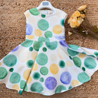 Abito bambina a pois colorati con gonna ampia