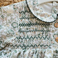 Abito bimba floreale verde Sardon in 100% cotone con punto smock