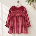 Abito bambina in velluto rosa antico con corpetto a punto smock e volant