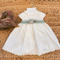 Abito battesimo bimba elegante con cintura in tulle verde salvia e fiori