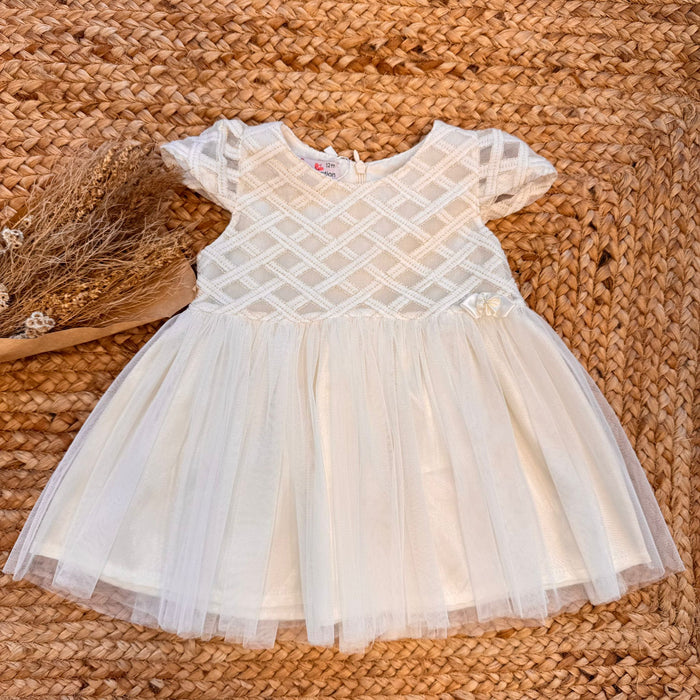 Abito battesimo bambina panna con fiocco e gonna in tulle leggero.