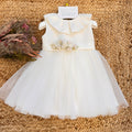 abito battesimo bimba panna con gonna ampia in tulle e fiori in vita