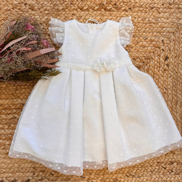Abito da battesimo bambina in tulle panna a pois con fiori in vita.