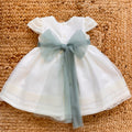 Abito battesimo bimba bianco panna con fascia verde salvia