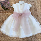 Retro abito con maxi fiocco rosa cipria in organza